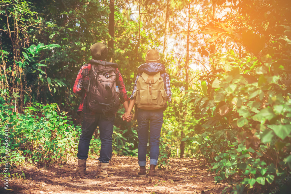 Hipster couple on a walk in an autumn nature.