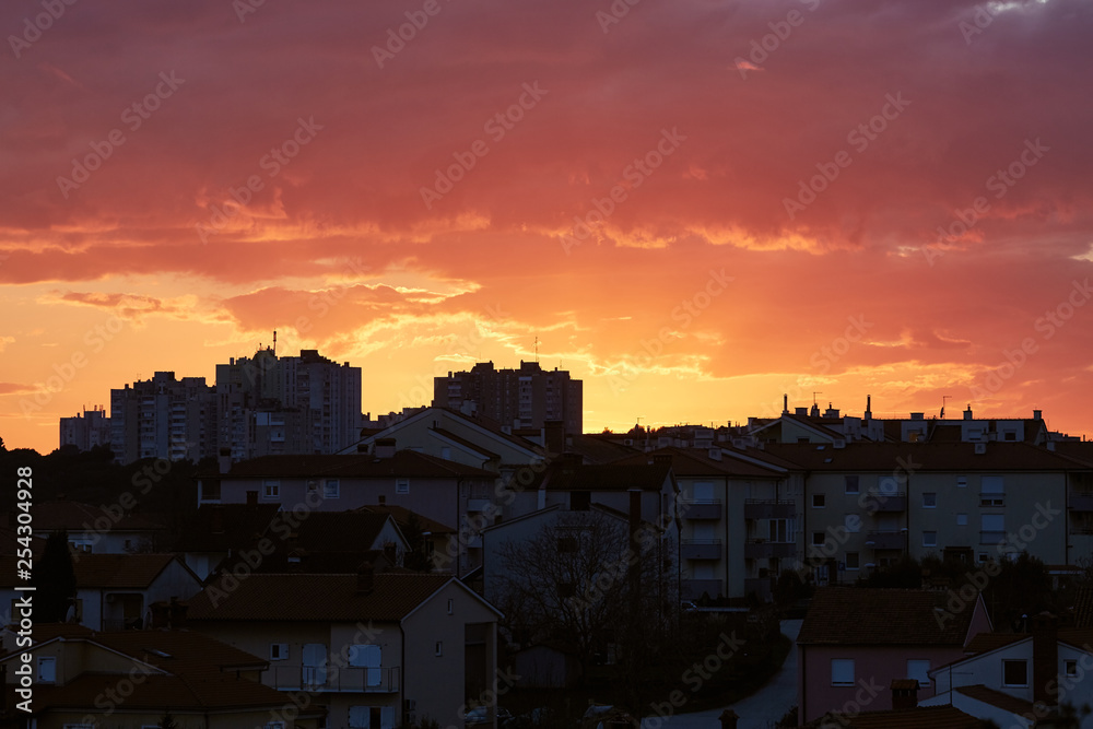 Sunset urban view, crimson sky