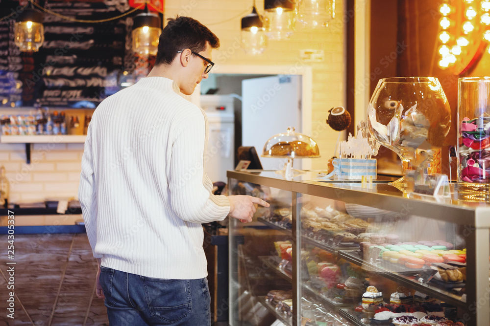 Young guy in a cafe. Young guy in a cafe.