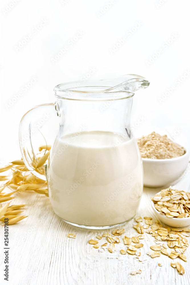 Milk oatmeal in jug on light board Milk oatmeal in jug on light board