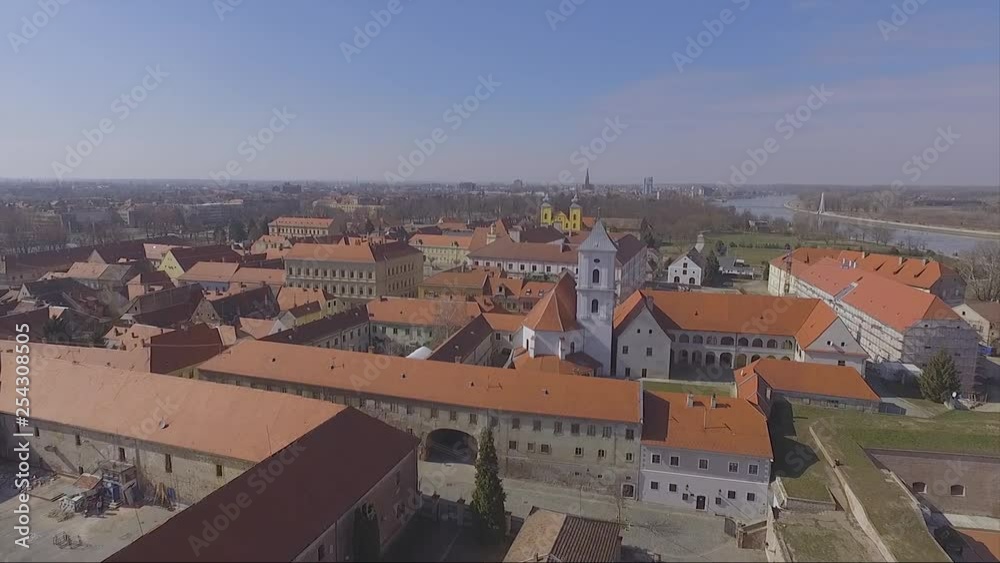 very low drone flyover, old town in europe by church towers and roofs very low drone flyover, old town in europe by church towers and roofs