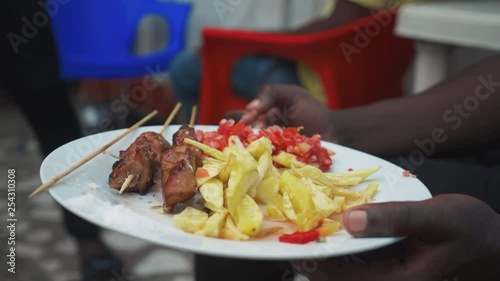A plate of local Tanzanian street food photo