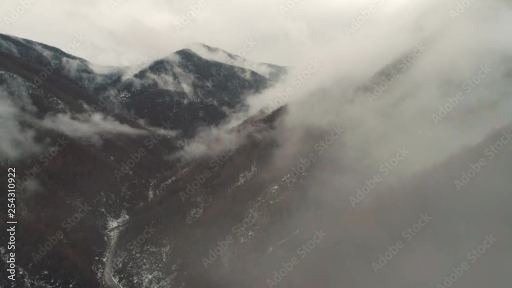 sharp peaks with clouds around them sharp peaks with clouds around them