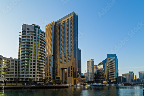 Dubai marina towers  boats and skyscrapers