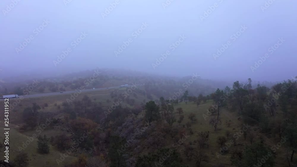Low Visibility on Foggy Morning along Highway in Tehachapi Mountains, AERIAL Low Visibility on Foggy Morning along Highway in Tehachapi Mountains, AERIAL