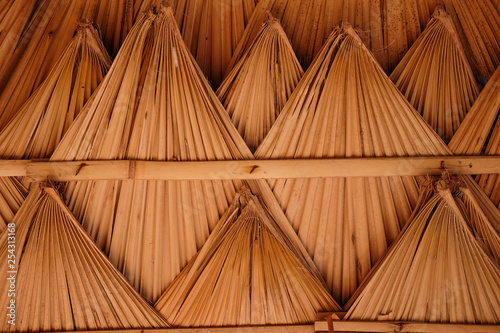 Fototapeta Naklejka Na Ścianę i Meble -  Roof made of dried palm leaves. 