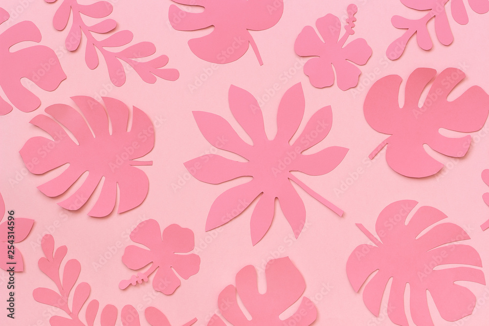 Tropical leaves pattern. Trendy pink tropical leaves of paper on pink background. Flat lay, top-down composition, creative paper art