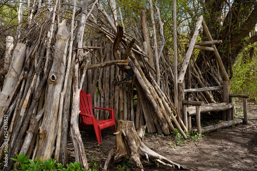 Fototapeta Teepee fort and bench hand made of woodland logs and sticks in a Toronto Park ur
