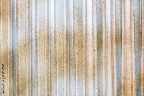 Industrial building wall made of corrugated metal sheet, flat background photo texture.