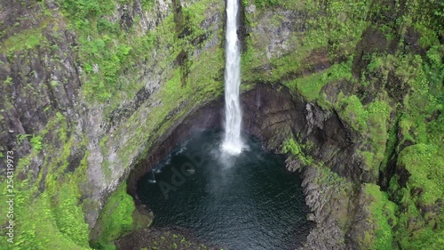 Aerial zoom out from one of the Takamaka waterfalls on the Marsouins River, Reunion Island photo