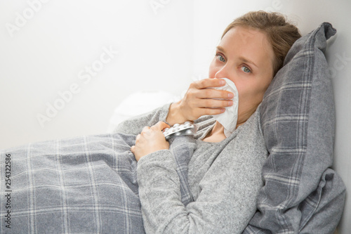 Upset young woman catching cold and feeling terrible