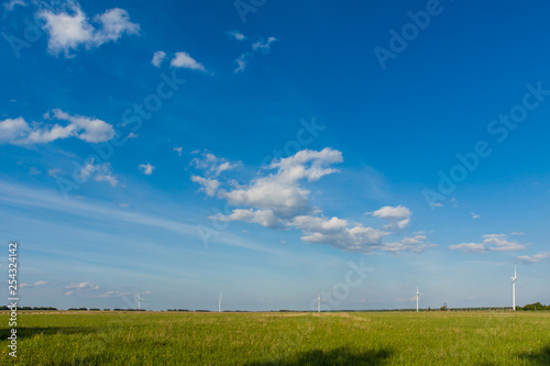 Windmills against the blue sky. © milayaludyam