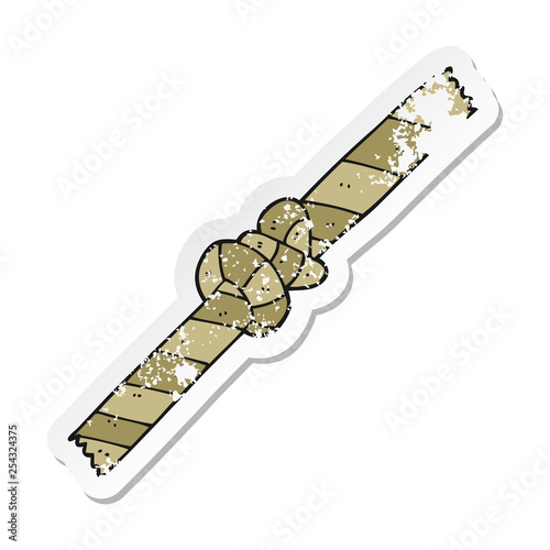 distressed sticker of a cartoon knotted rope