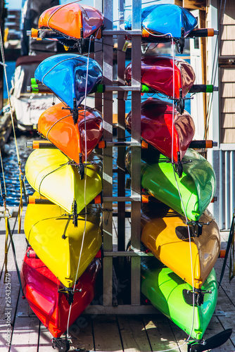 clourful stack of kayaks photo