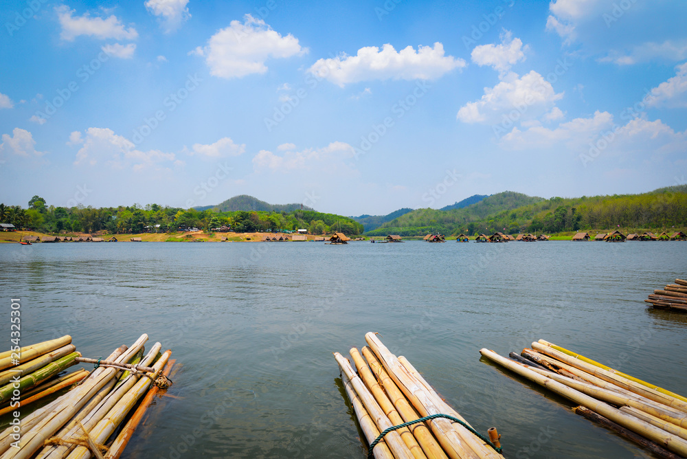 Relax travel river / Landscape of lake sky mountain and bamboo houseboat raft floating air fresh bright day Relax travel river / Landscape of lake sky mountain and bamboo houseboat raft floating air fresh bright day