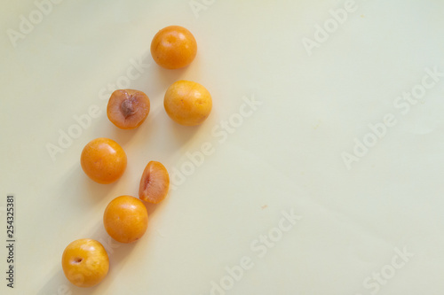 Yellow plums on a table