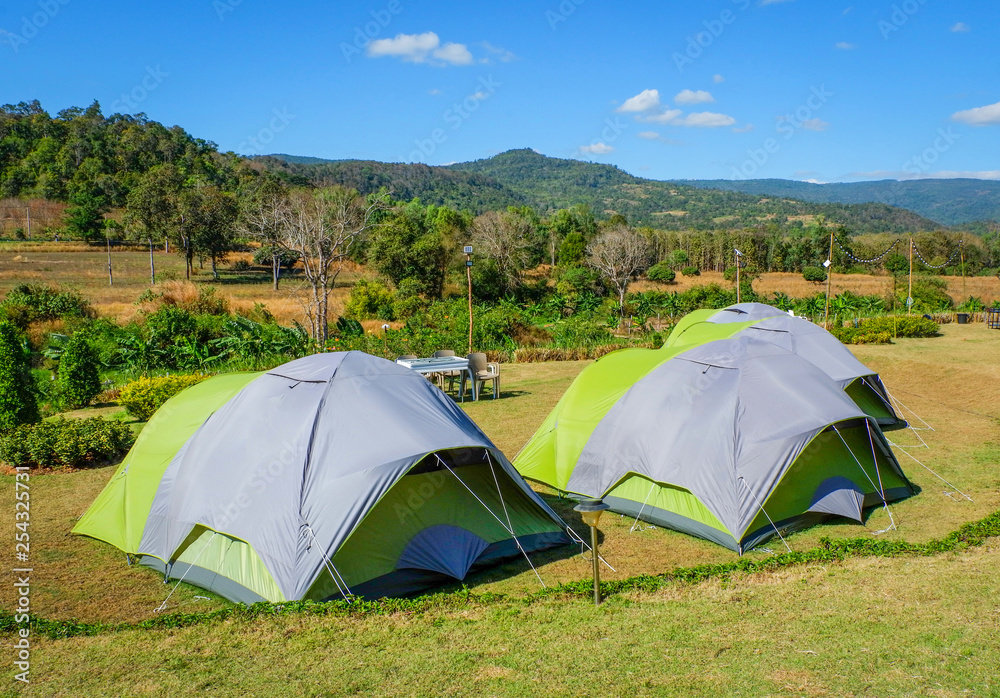 Camping tent tourist on hill  mountains background