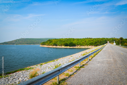 Road on dam or reservoir / Landscape river mountain and blue sky background