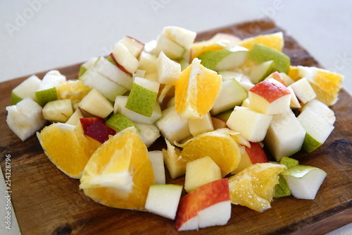 orange pear and apple prepared for a fresh and nutritious salad