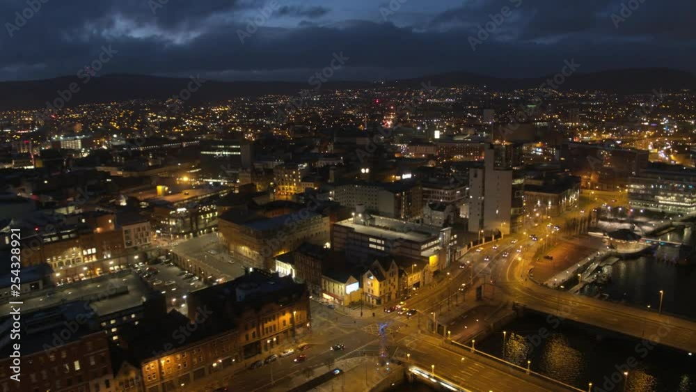 Aerial flyover of Belfast City Centre and Lagan River at night Aerial flyover of Belfast City Centre and Lagan River at night