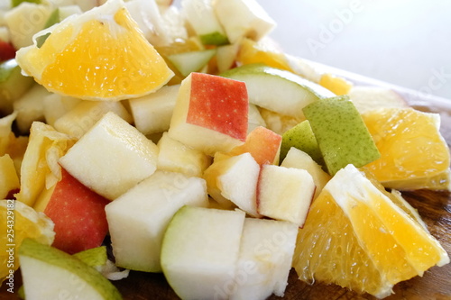 orange pear and apple prepared for a fresh and nutritious salad