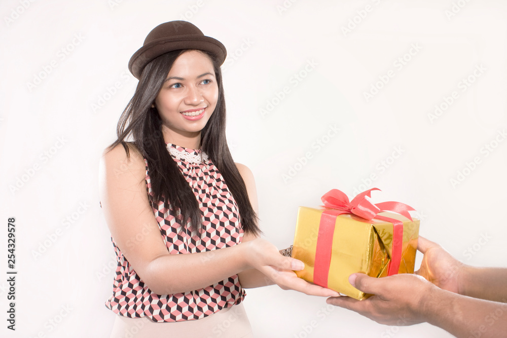 people gives a gift to young girl for birthday or valentine day love