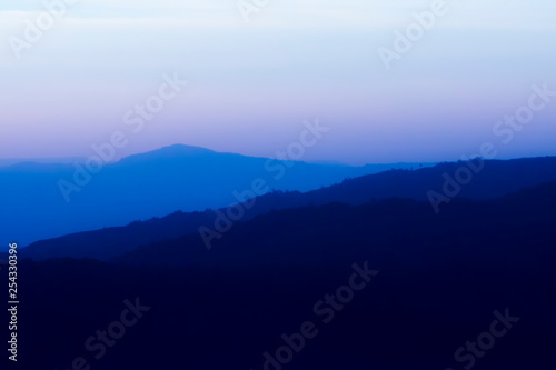 Soft silhouette of mountain with empty sky.