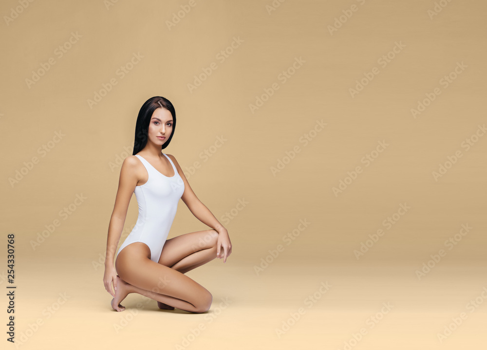 Obraz premium Sexy and beautiful woman in underwear. Beautiful and healthy girl with young and fit body posing in underwear. Sport, fitness, diet, nutrition and health concept.