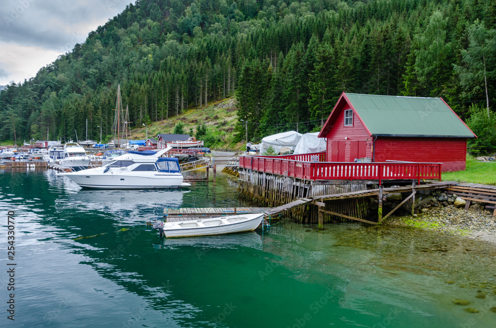 Pier with boats in the Norwegian village Kaupanger