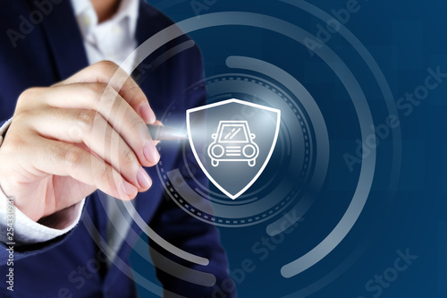 Business man hands pointing car and shield icon , car insurance concept.