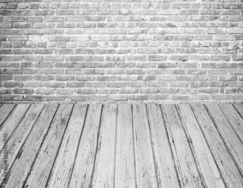 Grunge white brick wall with wooden floor