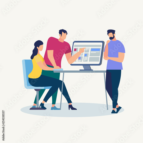 Young Men and Girl at Desk with Computer Monitor
