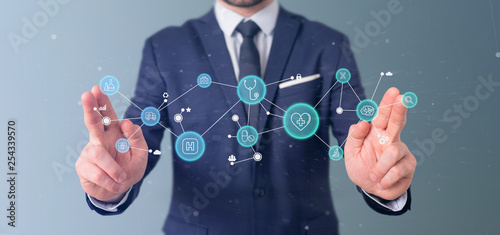Businessman holding Medical icon and connection 3d rendering