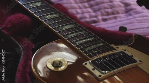 Man opening a guitar leather case. Closeup