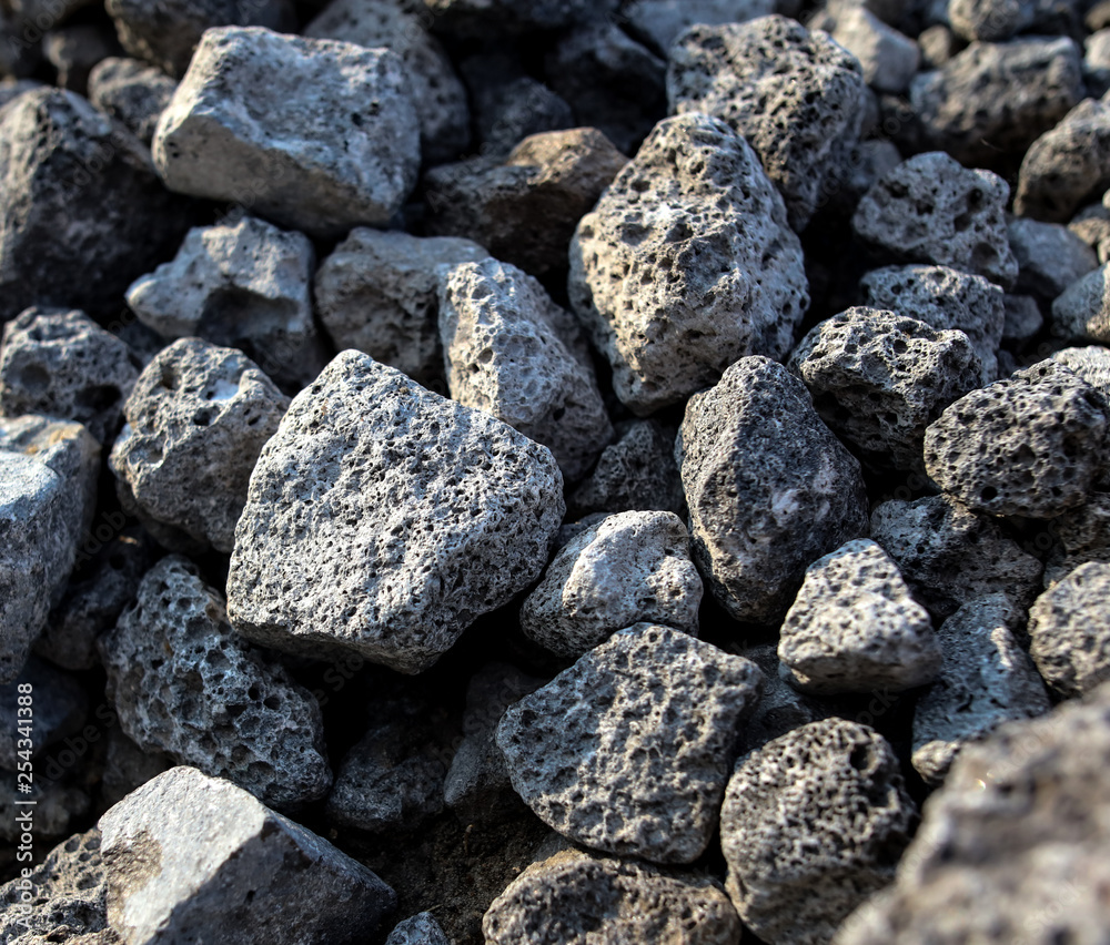 Stones on the edge of the asphalt road Stones on the edge of the asphalt road
