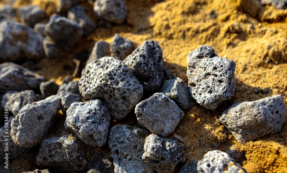 Stones on the edge of the asphalt road Stones on the edge of the asphalt road