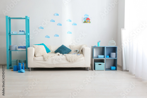 Interior of kids room with comfortable sofa © Pixel-Shot