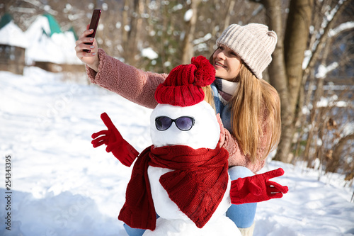 Happy woman taking selfie w...