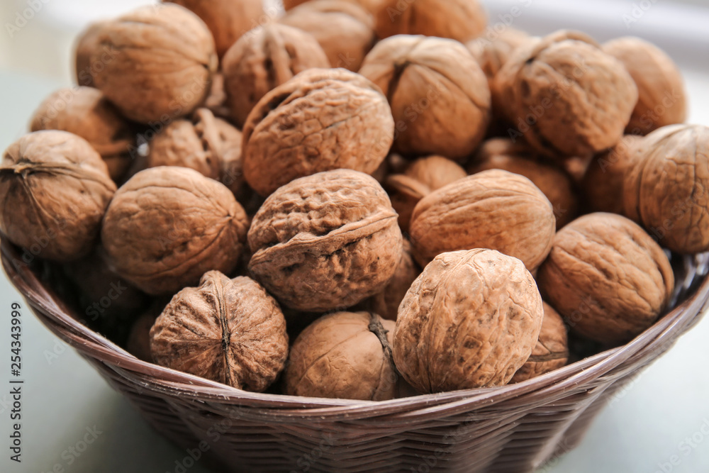 Tasty walnuts in bowl, closeup Tasty walnuts in bowl, closeup