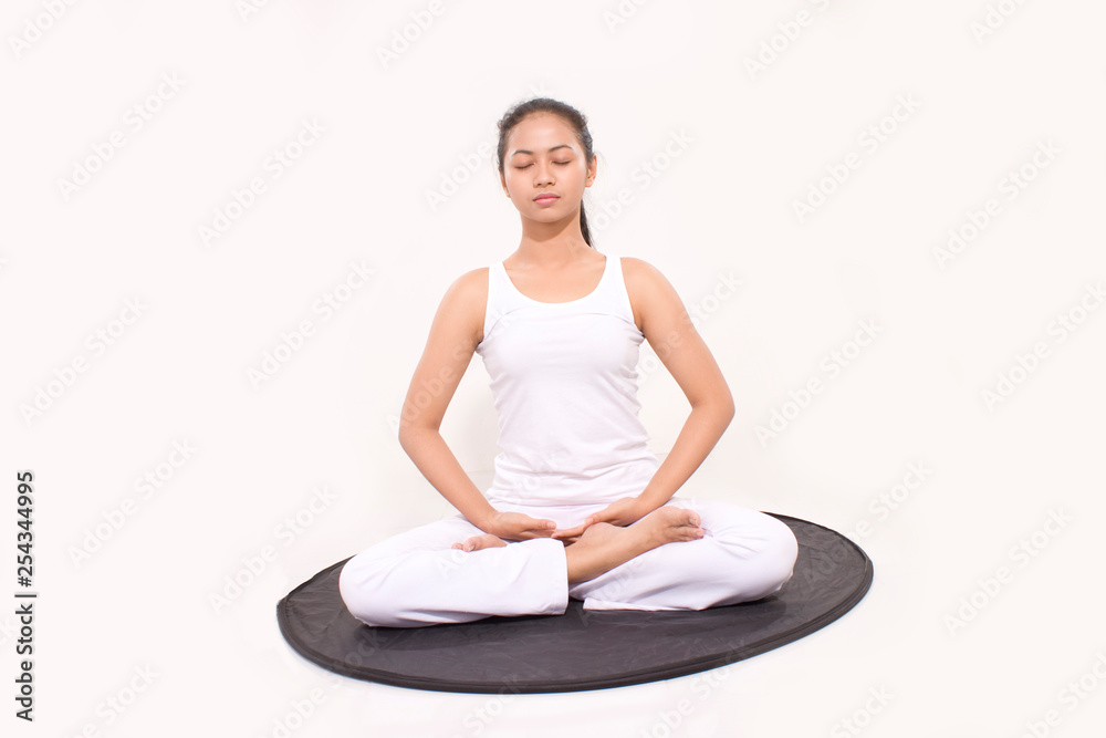 asian woman meditation isolated. asian woman practices yoga and meditates in the lotus position. asian woman meditation isolated. asian woman practices yoga and meditates in the lotus position.