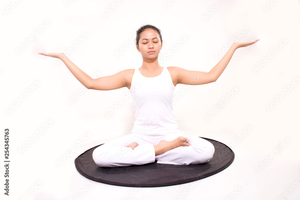 girl meditation asian women. Young attractive slim girl in bodysuit relaxing and doing exercises on a yoga mat. girl meditation asian women. Young attractive slim girl in bodysuit relaxing and doing exercises on a yoga mat.