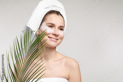 Woman with under-eye patche...