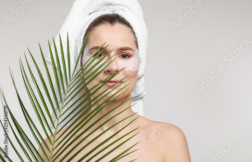 Woman with under-eye patche...