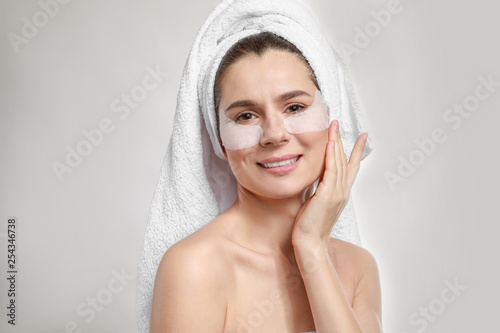 Woman with under-eye patche...