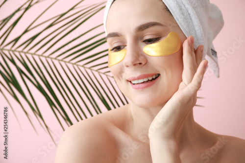 Woman with under-eye patche...