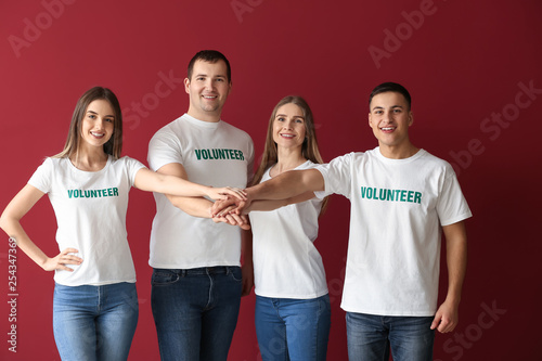 Young volunteers putting ha...
