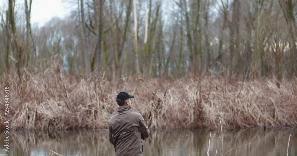 Fisherman holding fishing rod in hands Fisherman holding fishing rod in hands