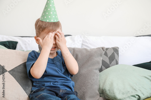 Sad little boy celebrating ...