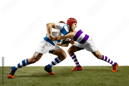 The silhouette of two caucasian rugby male players isolated on white background. Studio shot of fit men in motion or movement with ball. Jump and action concept. An incredible strain of all forces.
