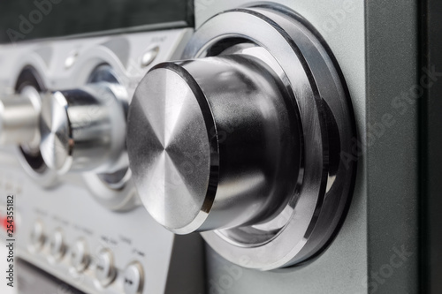 Volume control knob of home music system at selective focus